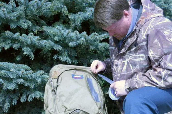 Temporary repair of backpack with duct tape