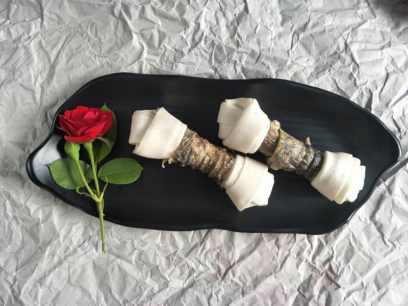 fish  rolled bleached rawhide knotted bone