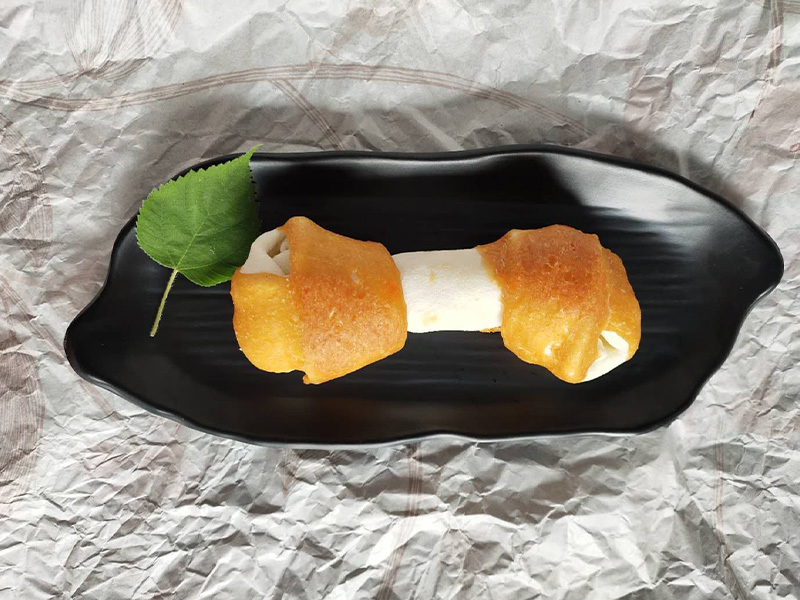 expanded rawhide knotted bone with chicken on both ends