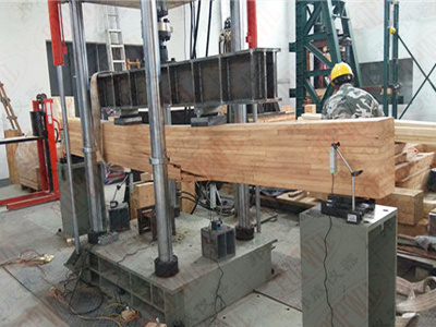 Flexural test system for glued laminated timber beams