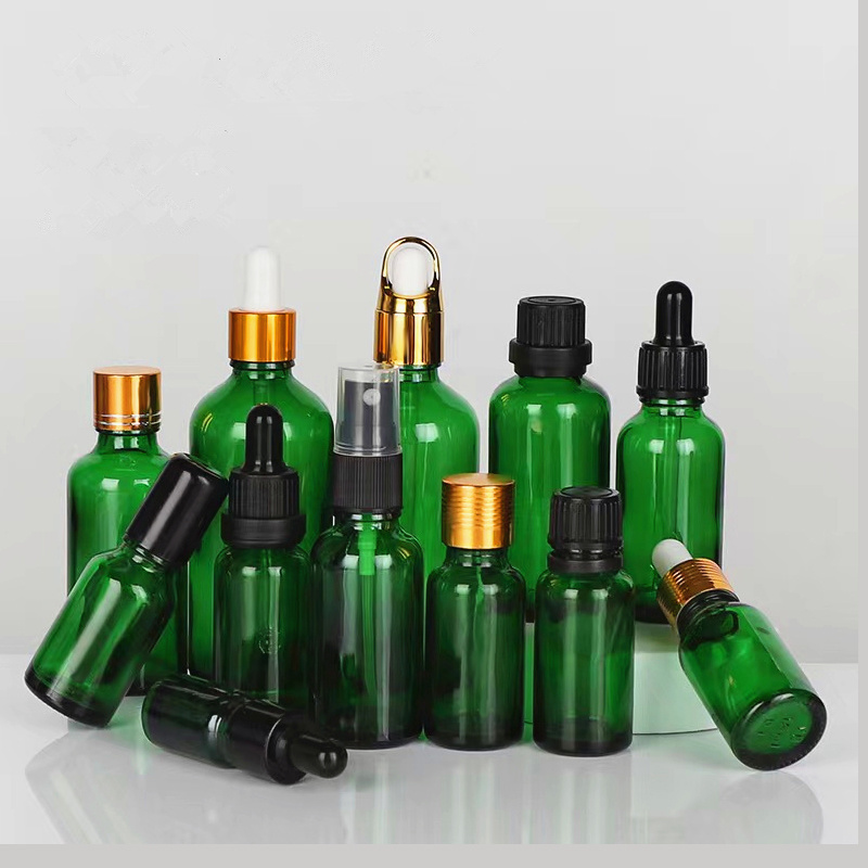 wholesale  glass container green essential oil glass bottle with  lids