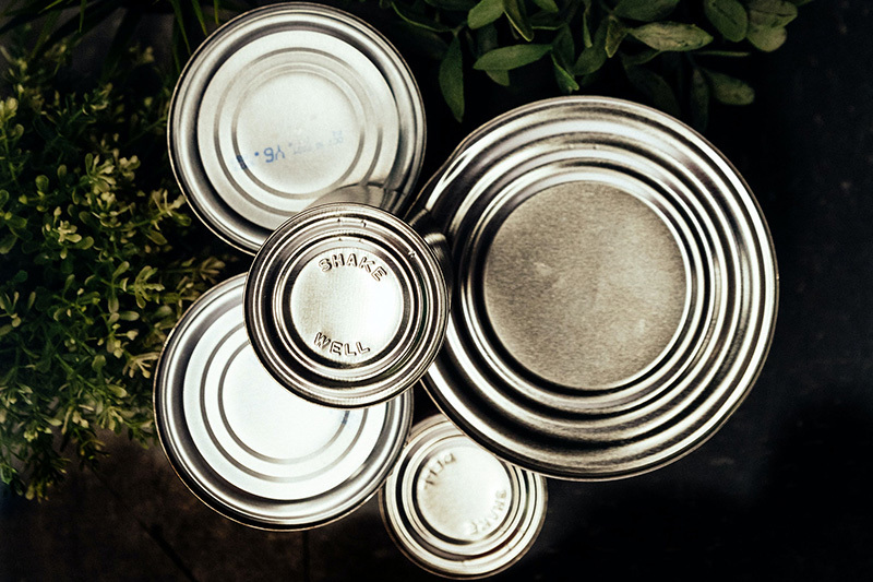 Why are aerosol cans almost all made of tinplate?