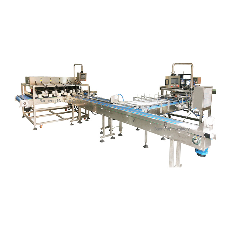 Boxes/trays distributing and conveying machine