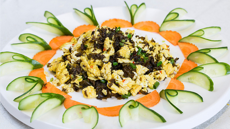 Stir fried Eggs with Mountain Vegetables and Reed Buds