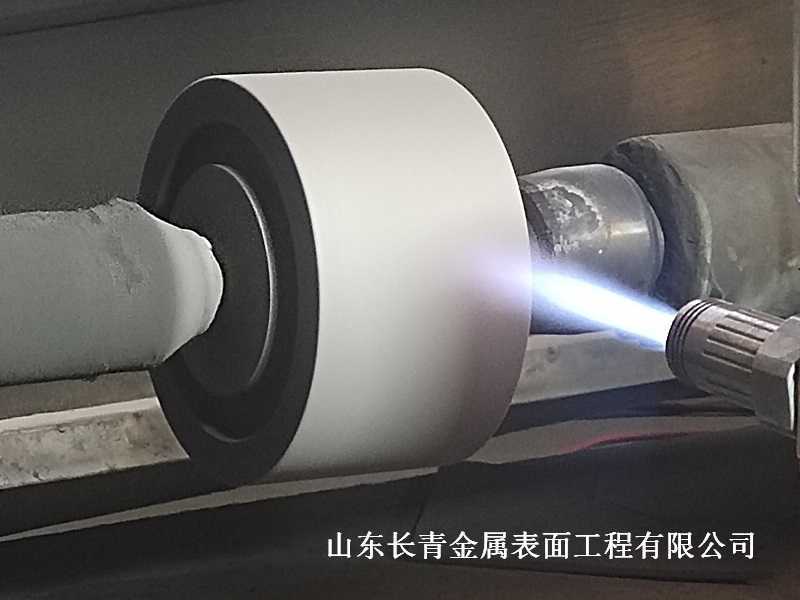 長青金屬熱噴涂公司對導輪噴焊耐磨噴涂