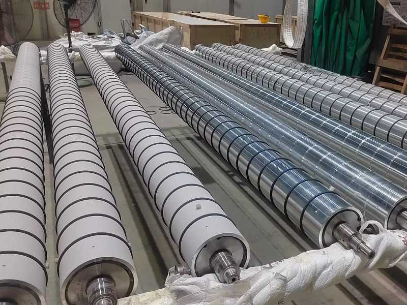 長青金屬熱噴涂公司對托輥噴砂表面強(qiáng)化