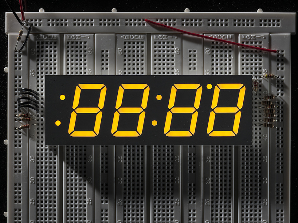 Yellow 7-segment clock display - 1.2 digit height