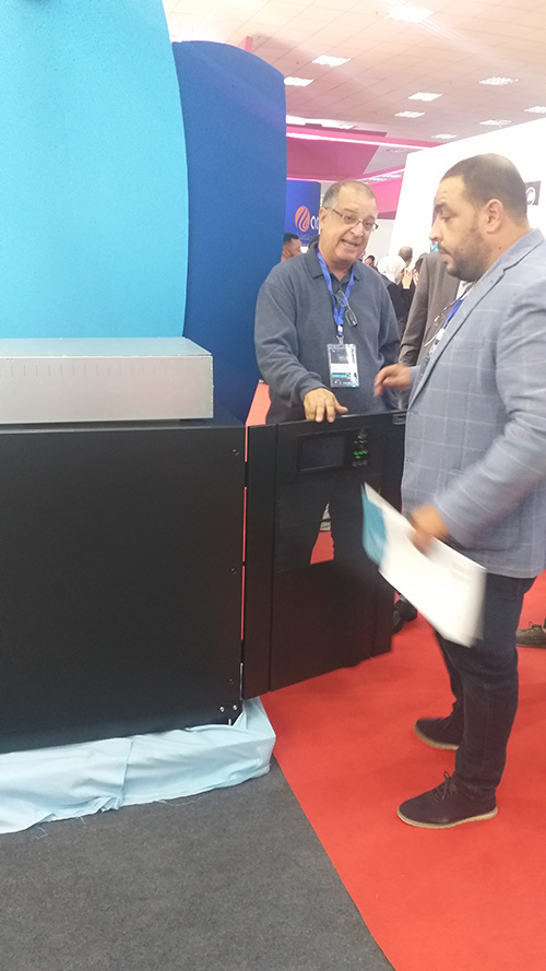 talk with visitors in the Ninth Libya International Telecommunication and Information Technology Exhibition - INVT Power 1