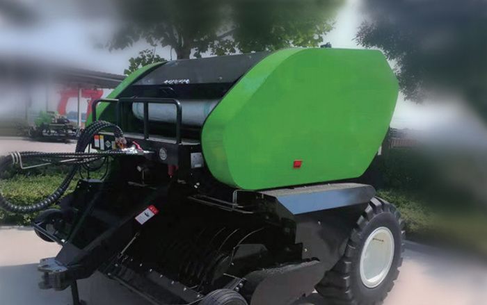 Hydraulic and electrical system integration solution for round baler