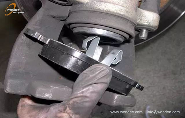 Why do you have to step on the brakes twice before driving after changing the brake pads?