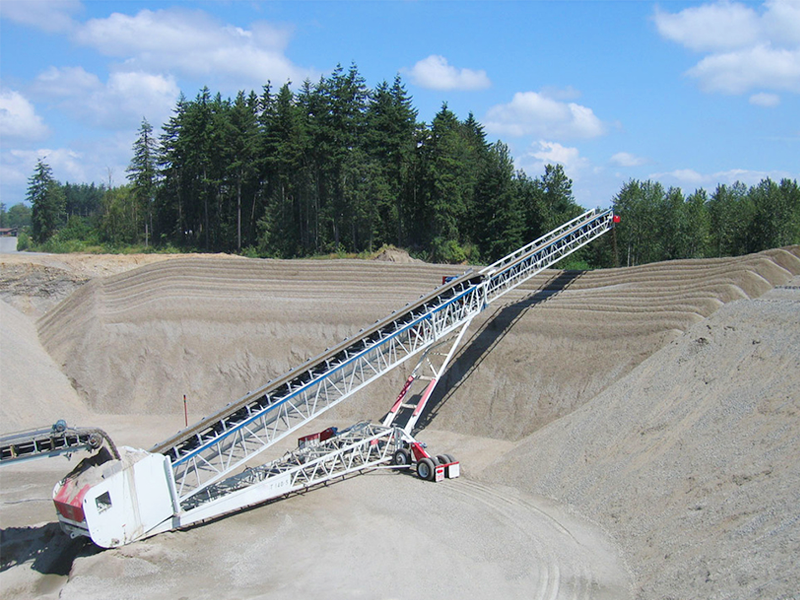 Radial rotary retractable stacker