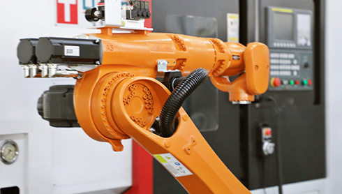 How are industrial robots and machine tools integrated and applied