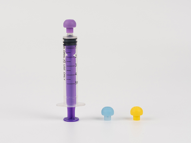 Oral syringe with protective cap