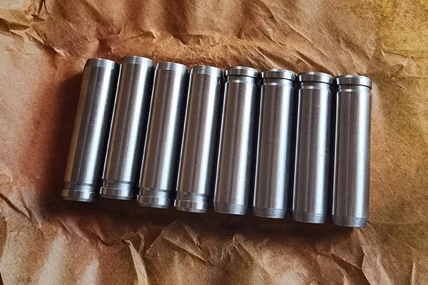 What is the function of the engine valve guide?
