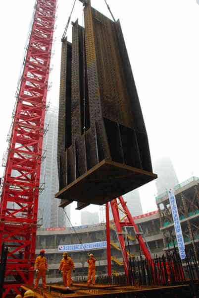 Installation of first steel column in Main Building on April 20, 2010