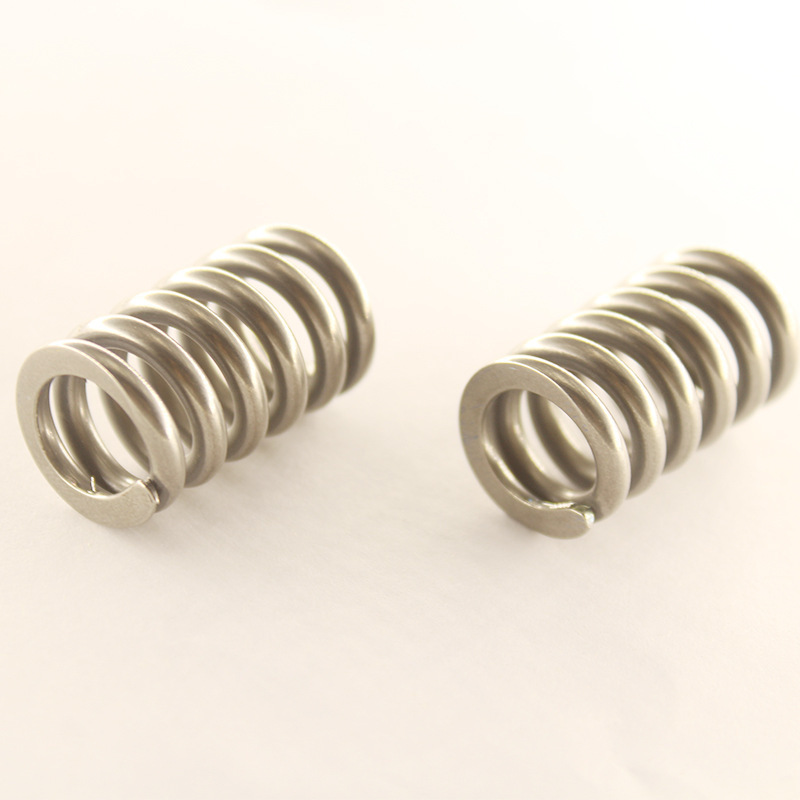 Nickel titanium alloy temperature controlled memory alloy spring