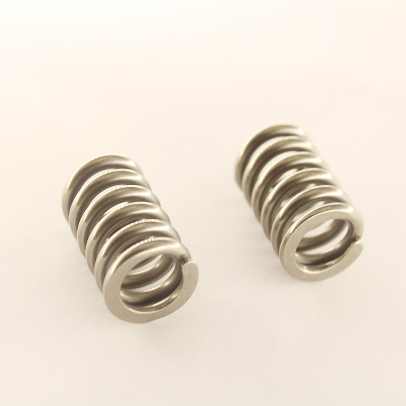 Nickel titanium alloy temperature controlled memory alloy spring