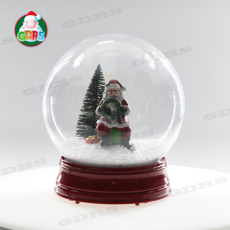 10In Christmas musical snowing globe