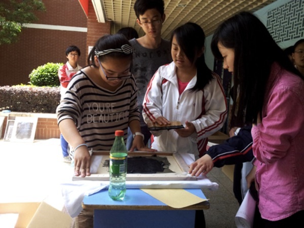 Volunteers showed their talents in printing cultural shirts at the Art Festival