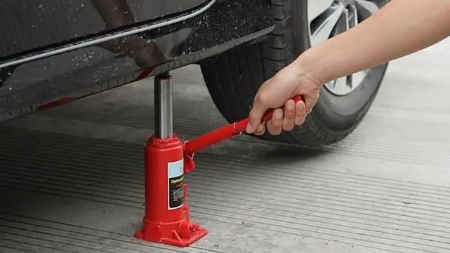 A jack is a common tool used to lift heavy objects or increase strength.