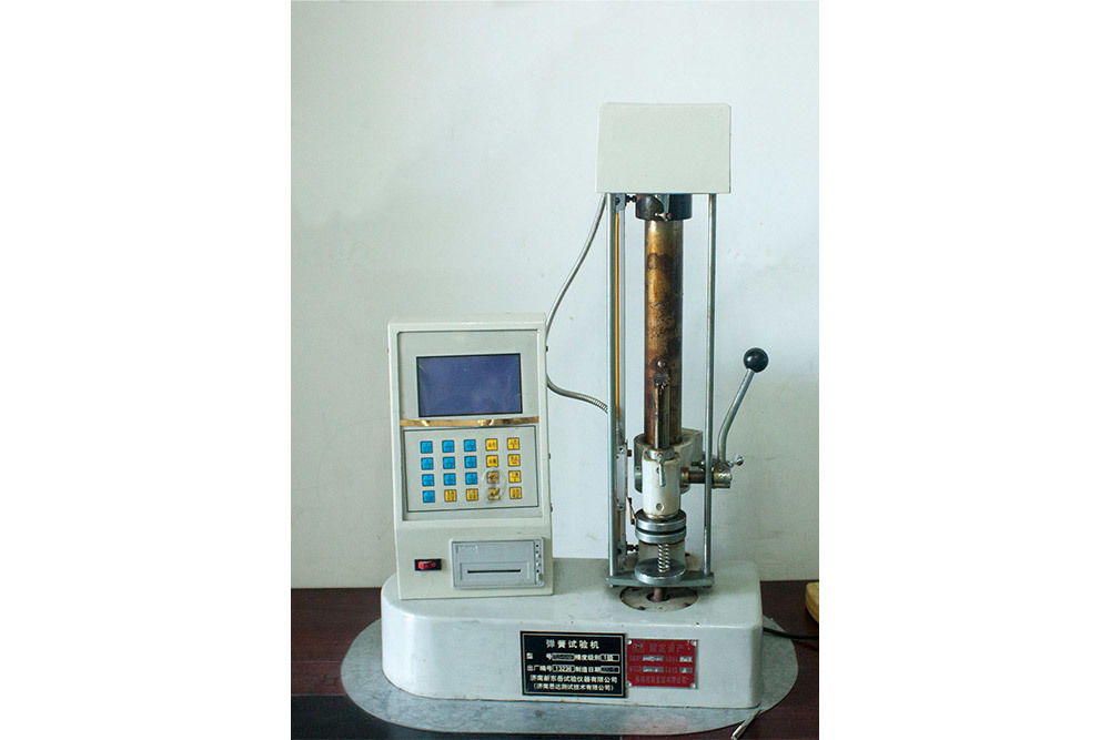 Spring testing machine