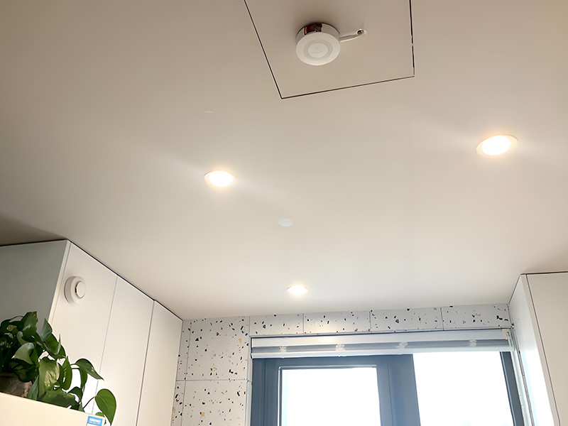 Is the red dot on the smoke alarm hiding the camera?