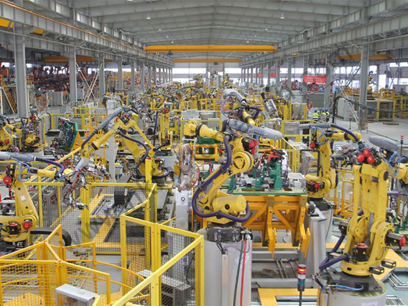 Safety fence supporting Fanuc robots in automotive factory