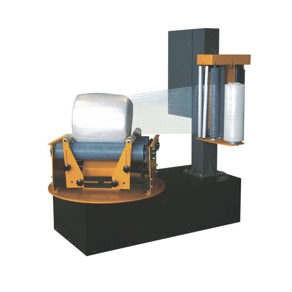 Small roll wrapping machine