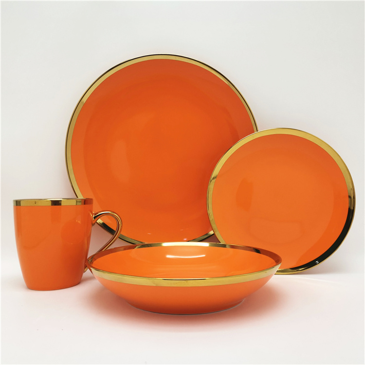 Orange color glazed coupe shape porcelain dinnerware with wide gold rim design