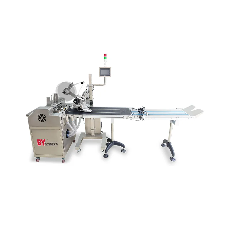 Machine automatique d'étiquetage et de pagination