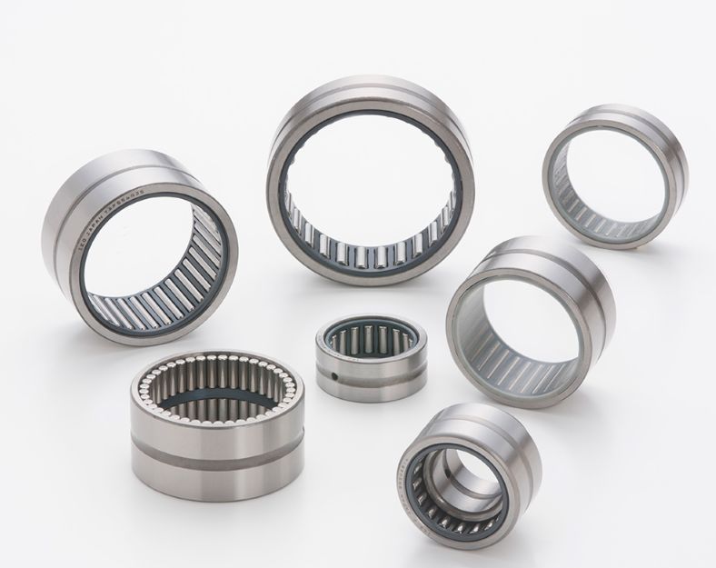 What are the main differences between needle bearings and ball bearings?