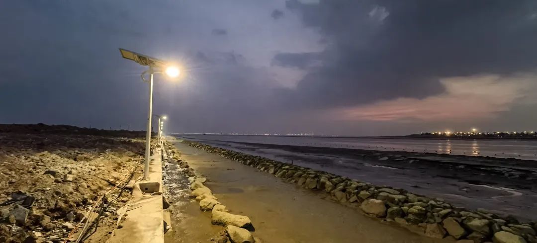 Shajing coastline in the hinterland of the bay area glittered with light