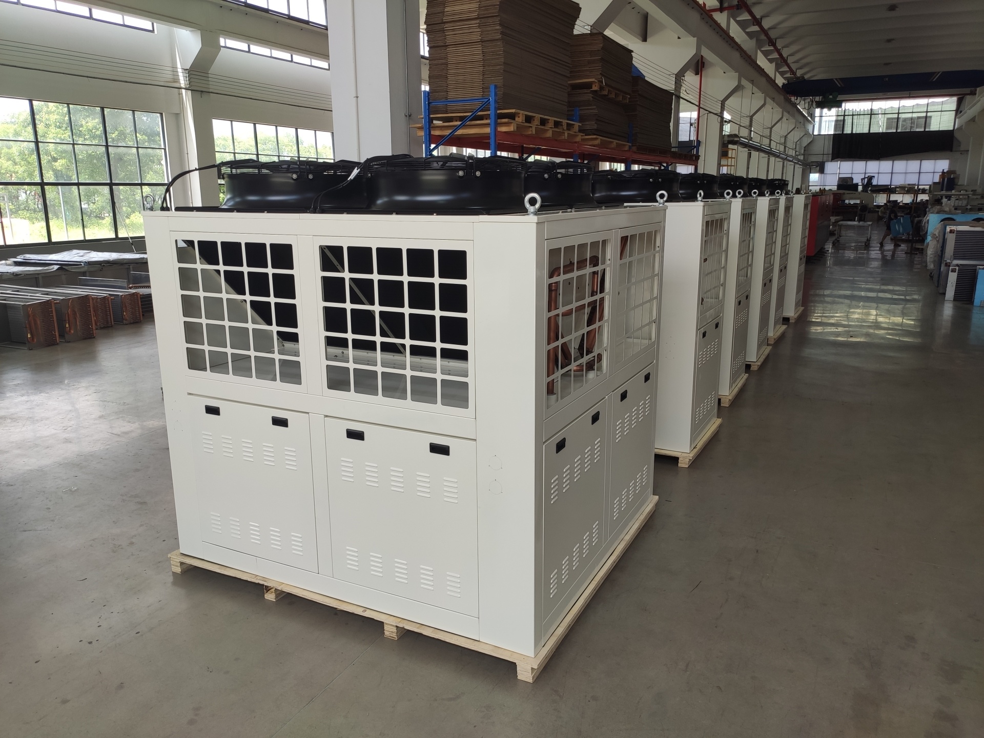 Air cooled condenser with housing