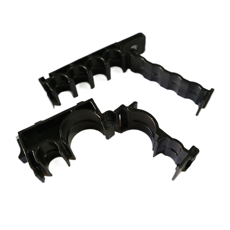 Press the retaining cable clamp