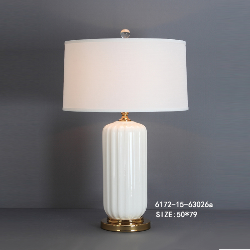 Ceramic table lamp with brass base and linen lampshade