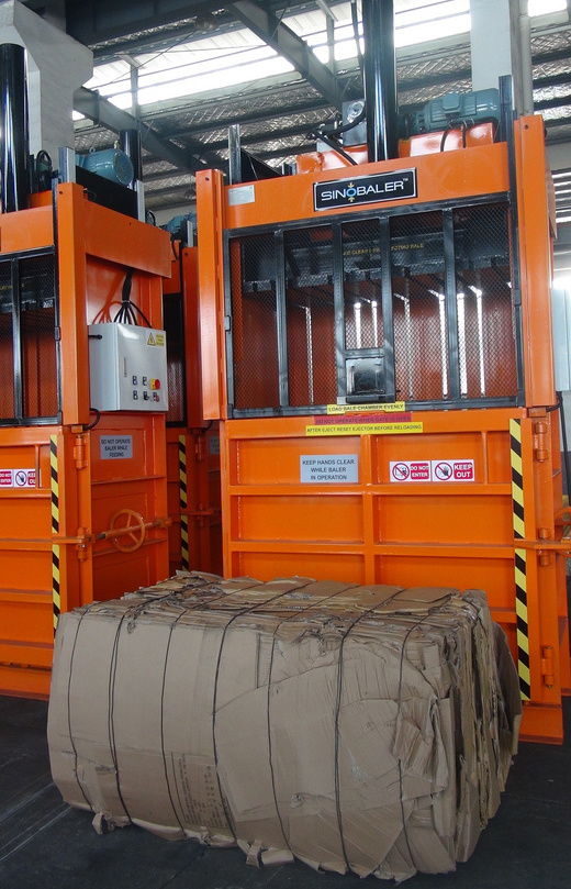 Vertical cardboard baler and cardboard bale Vertical cardboard baler and cardboard bale