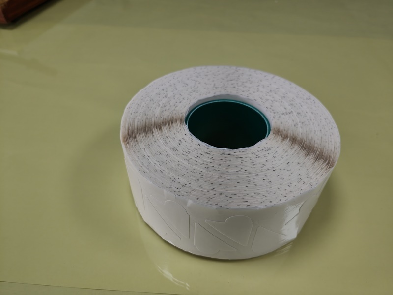 Double-sided tape with ears