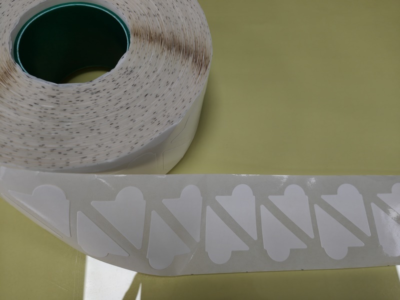 Double-sided tape with ears