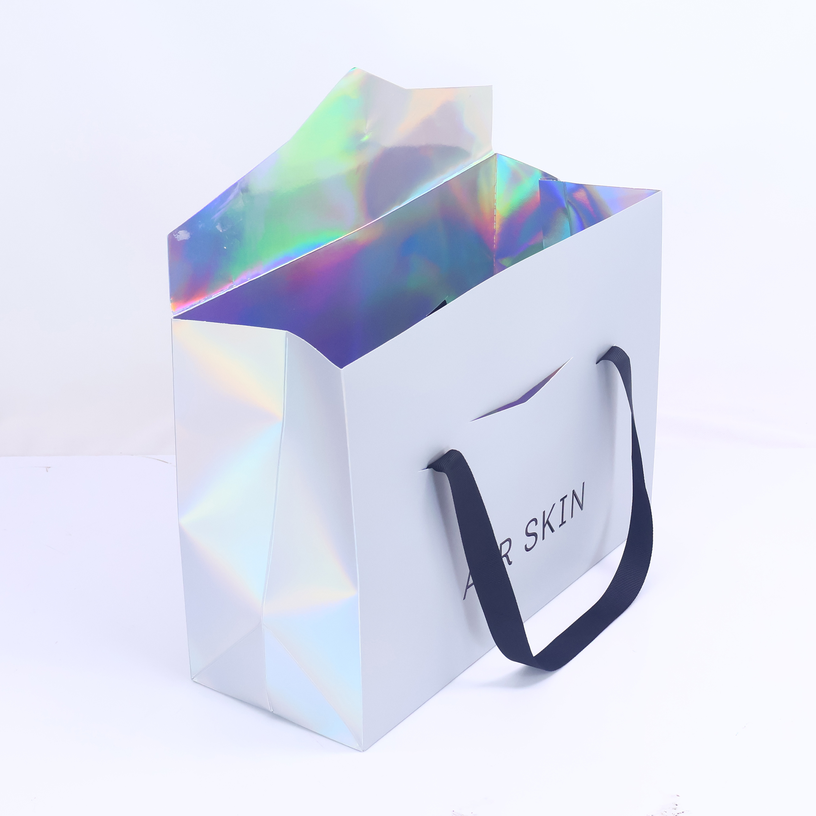 Grey triangular paper bag with ribbon handle