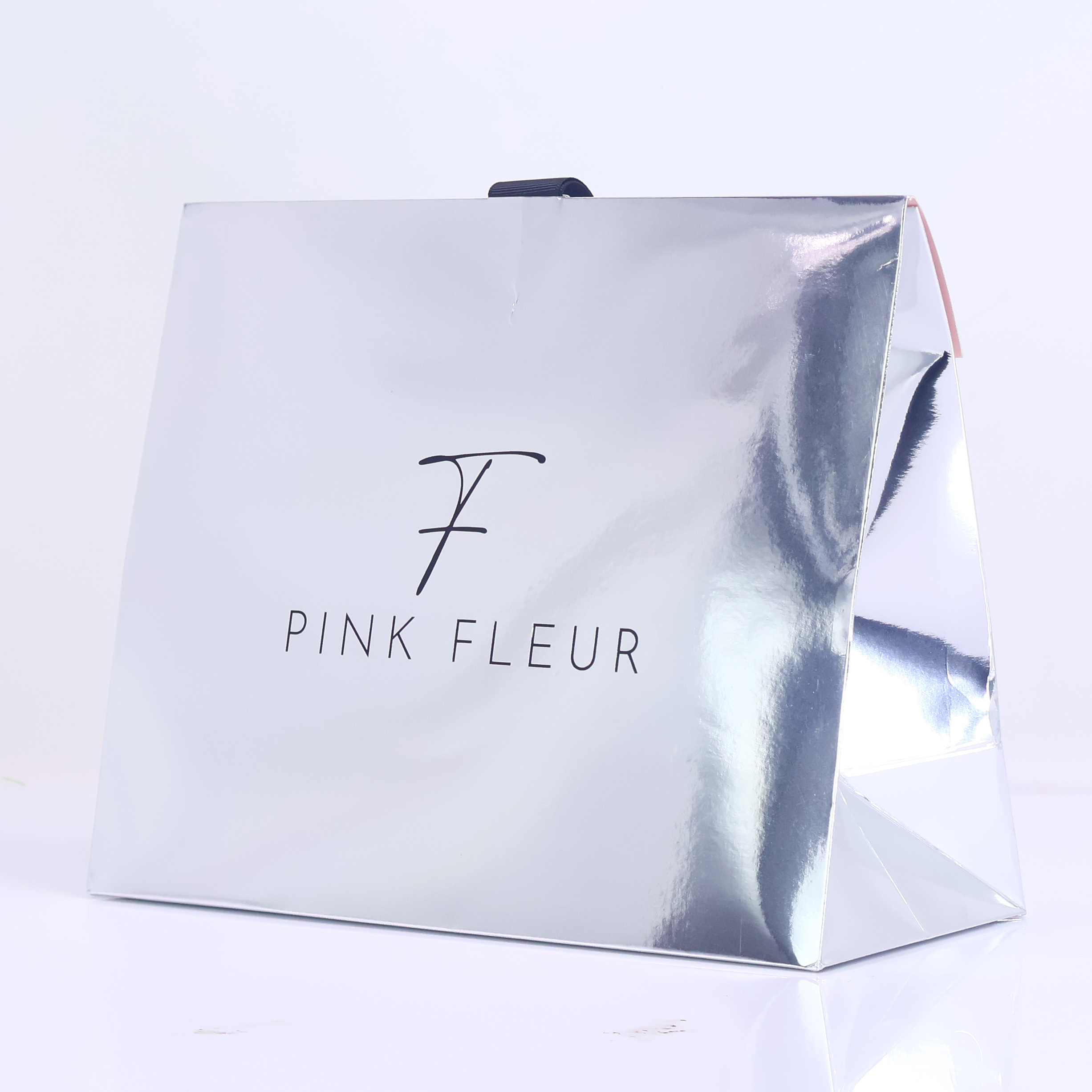 Silver reflective triangular paper bag
