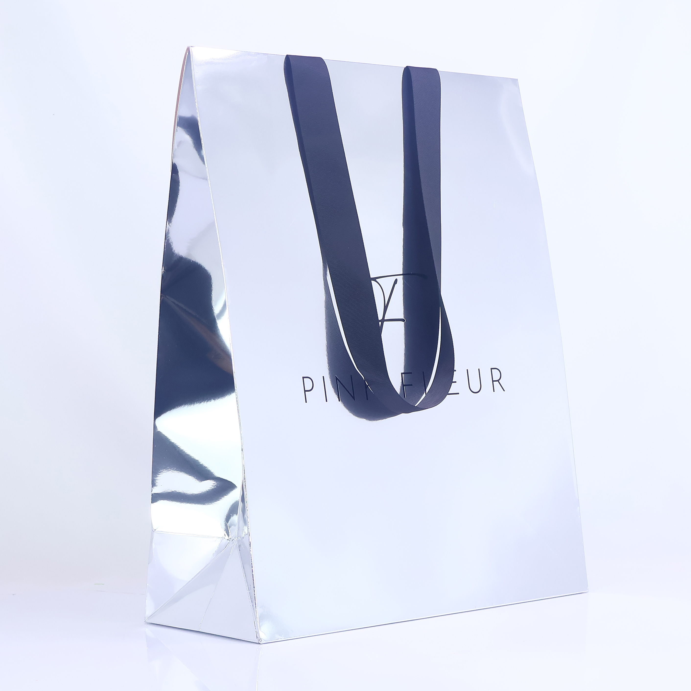 Silver reflective triangular paper bag