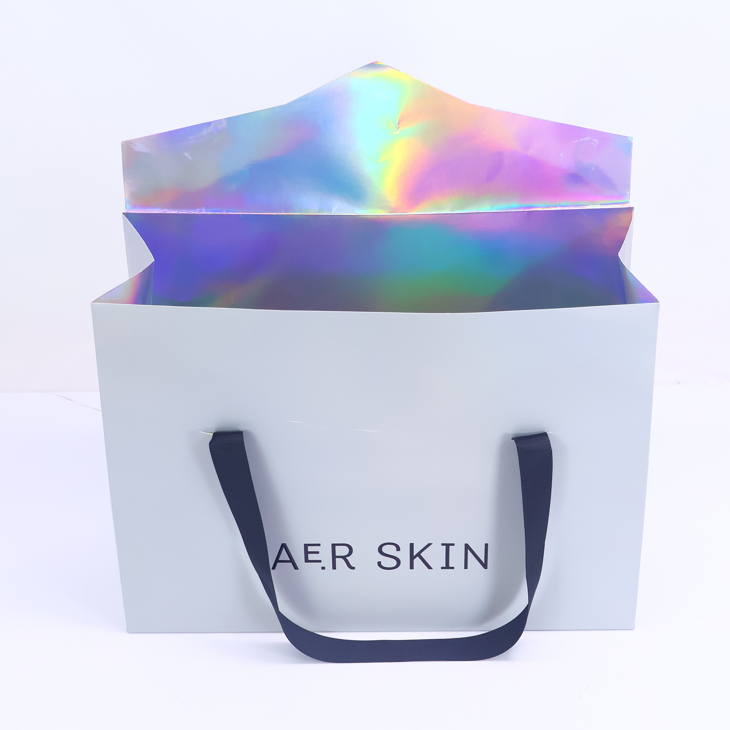 Grey triangular paper bag with ribbon handle