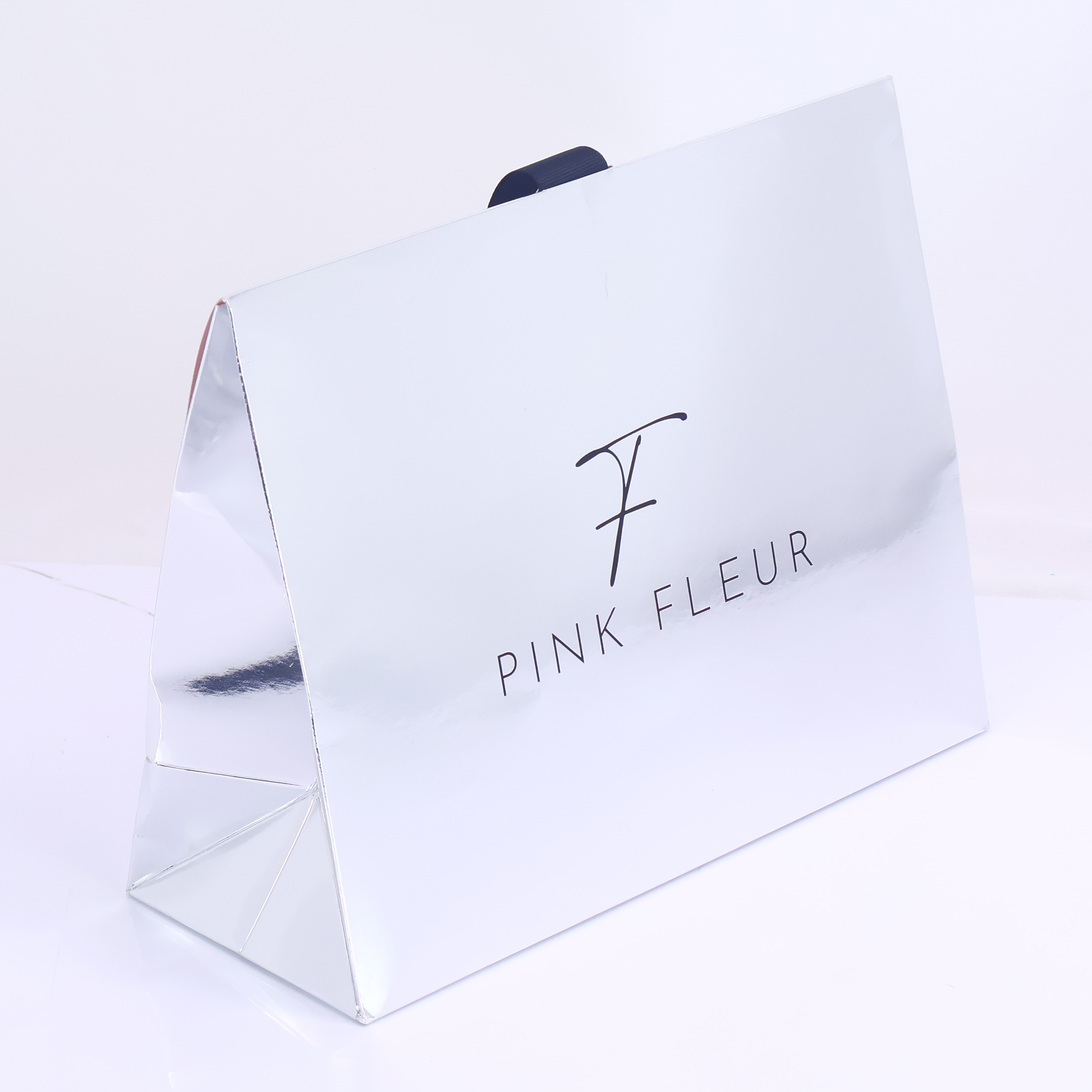 Silver reflective triangular paper bag