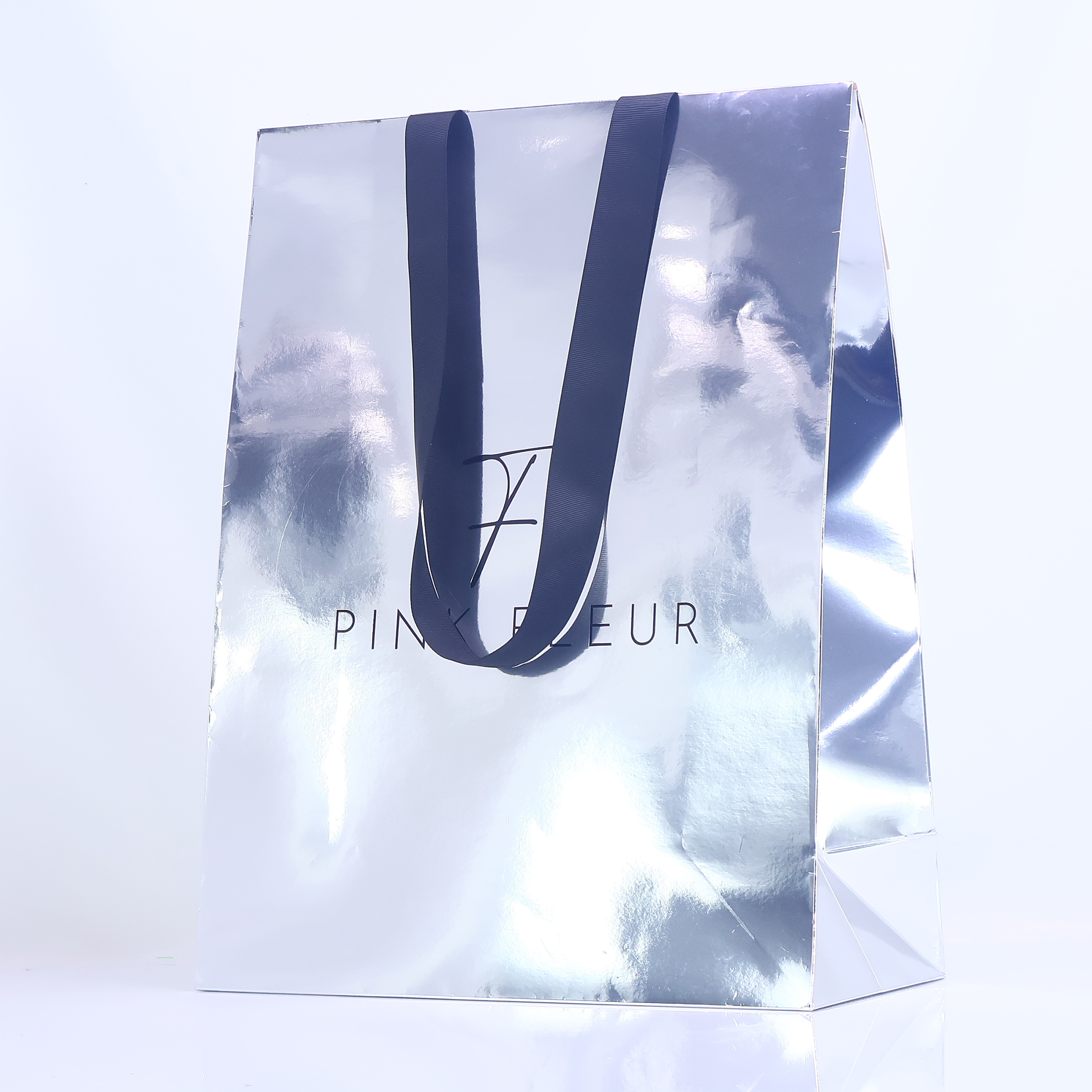 Silver reflective triangular paper bag
