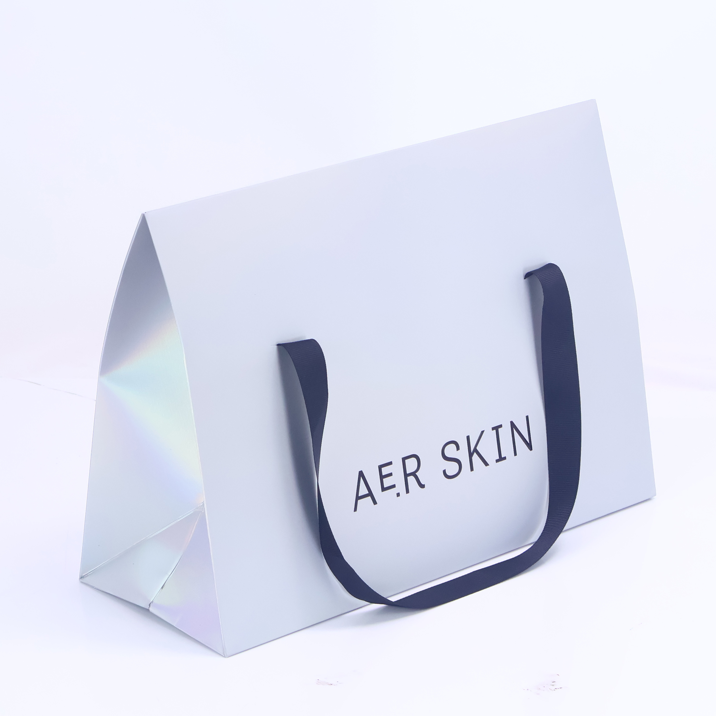 Grey triangular paper bag with ribbon handle