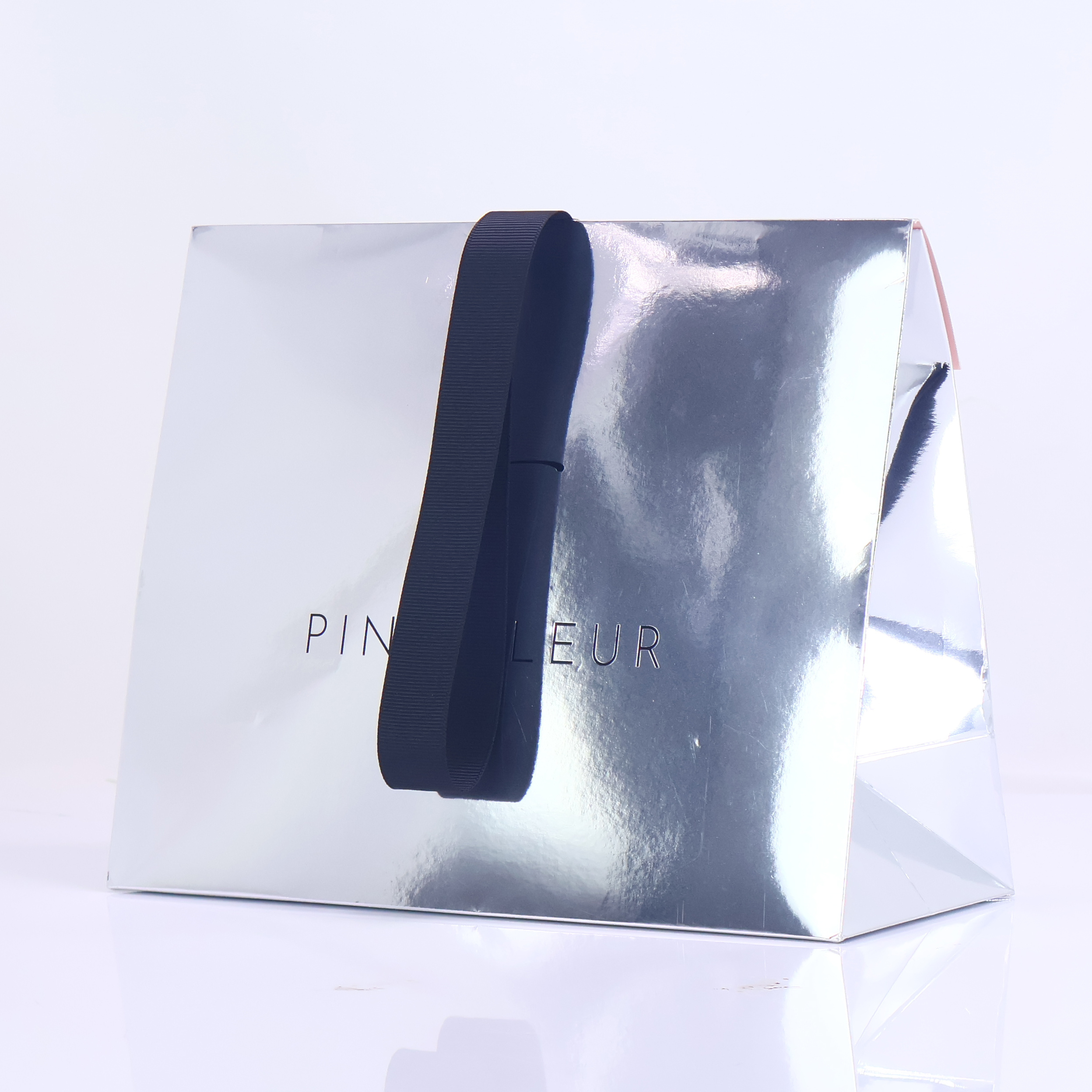 Silver reflective triangular paper bag