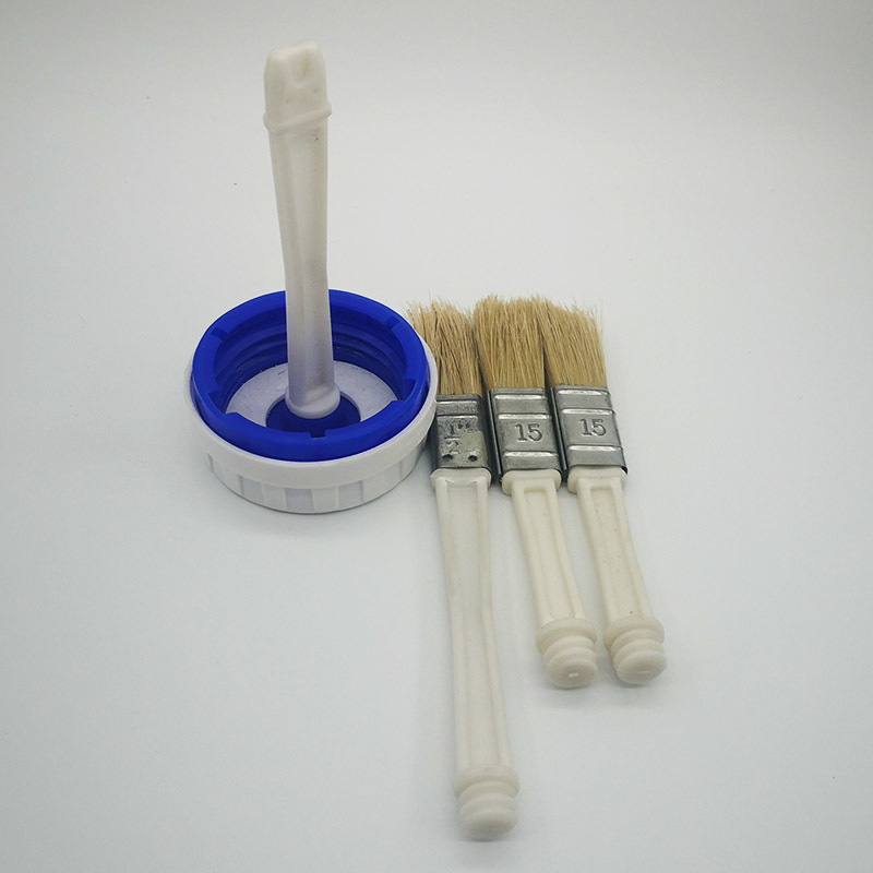 A smear brush. bottle cap brush