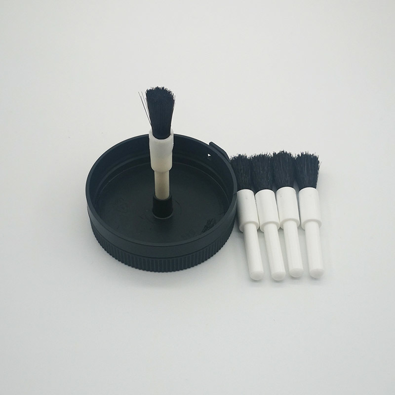 A smear brush. bottle cap brush