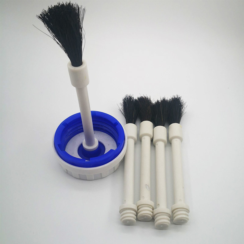 A smear brush. bottle cap brush