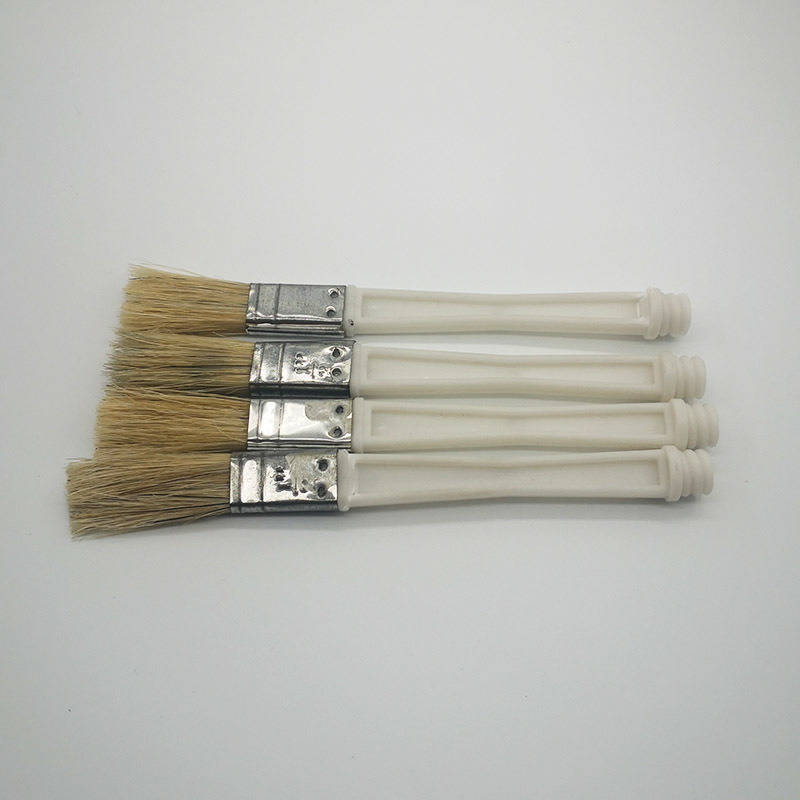 A smear brush. bottle cap brush